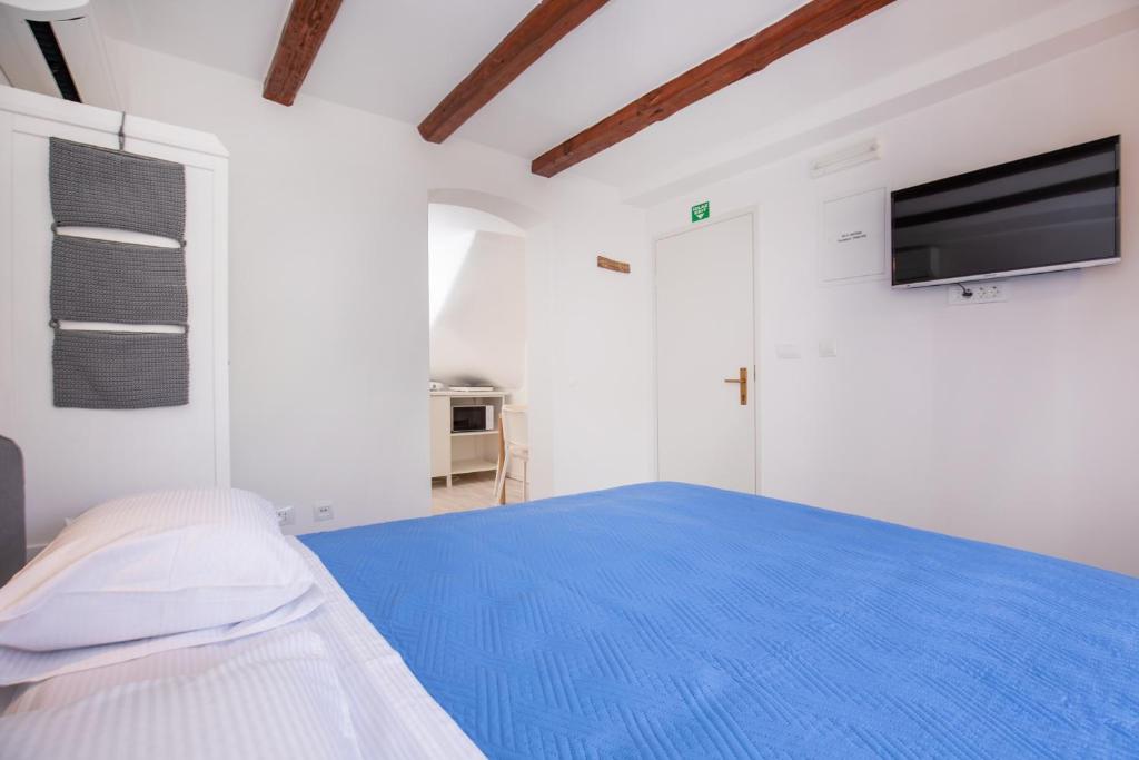 Postel nebo postele na pokoji v ubytování Studio Apartment Bell