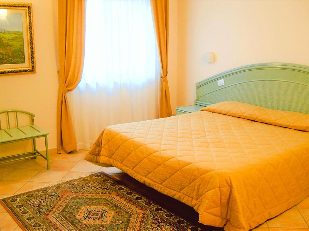 Posteľ alebo postele v izbe v ubytovaní La Bastia Hotel & Resort