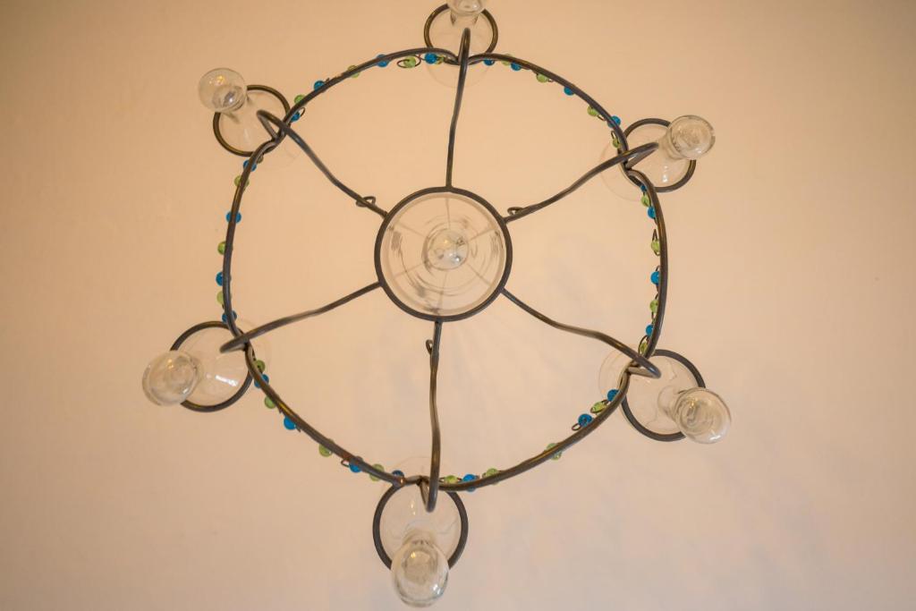 a chandelier made out of glass and beads at Lantern Guest House in Marsalforn