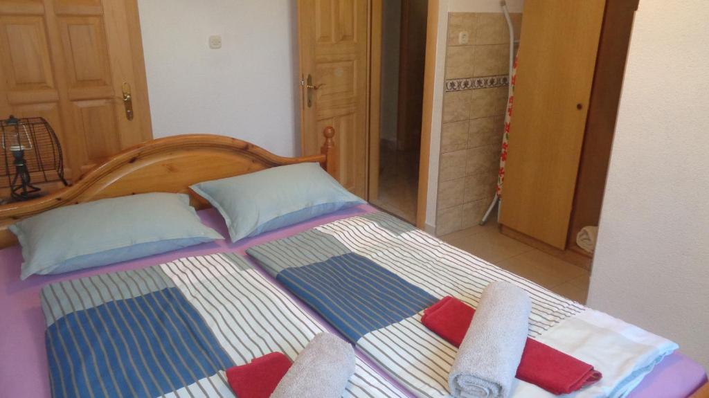 Postel nebo postele na pokoji v ubytování Apartments Moreta
