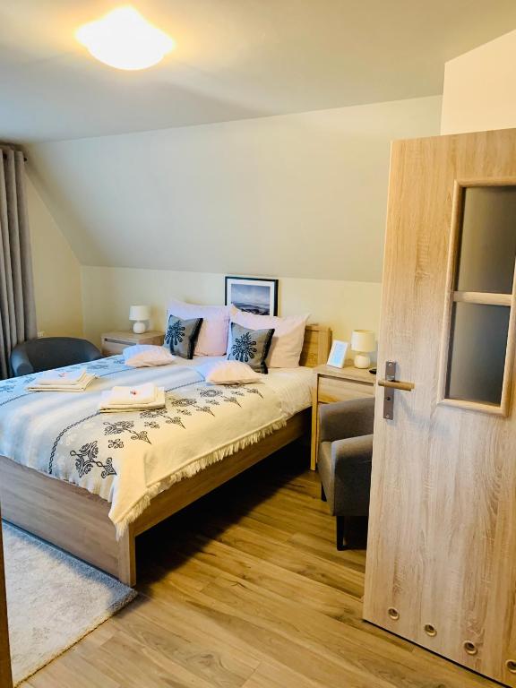 Postel nebo postele na pokoji v ubytování Apartamenty u Magika