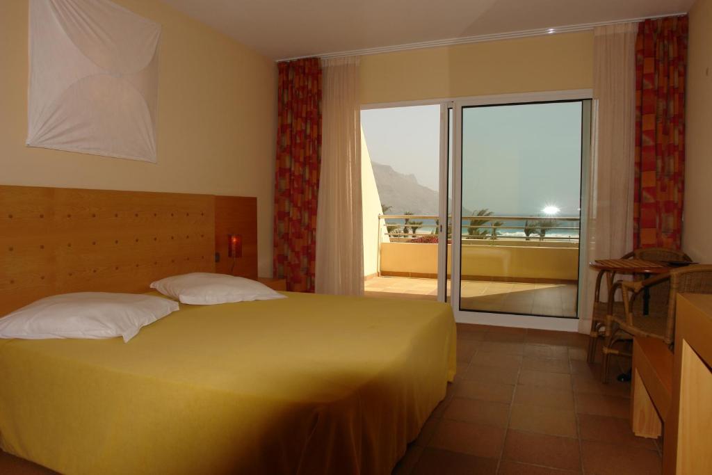 Кровать или кровати в номере Flag Hotel Foya Branca
