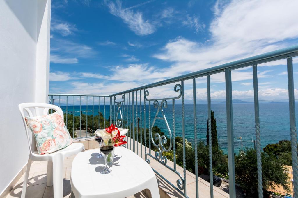 a balcony with a view of the ocean at Corfu Aquamarine in Nótos