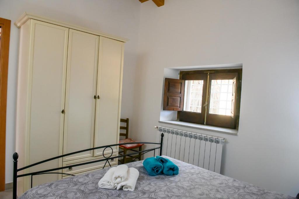 Postel nebo postele na pokoji v ubytování Terrazzo sullo Ionio
