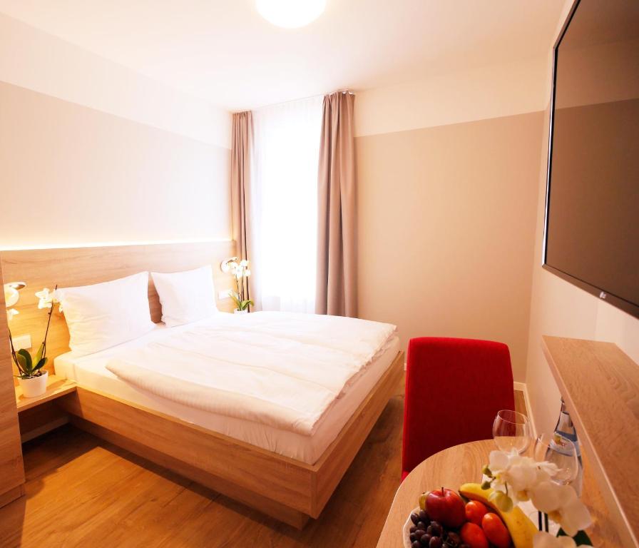 Postel nebo postele na pokoji v ubytování KELKO 1A Hotel