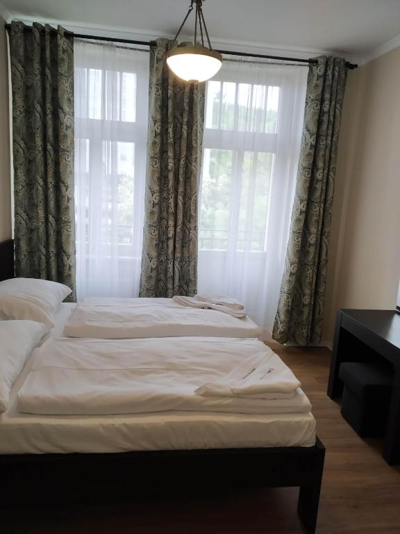 Postel nebo postele na pokoji v ubytování Rezidence Beethoven