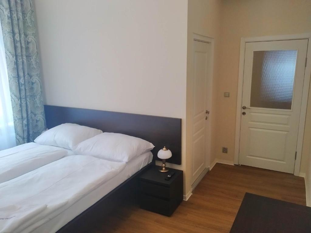 Postel nebo postele na pokoji v ubytování Rezidence Beethoven