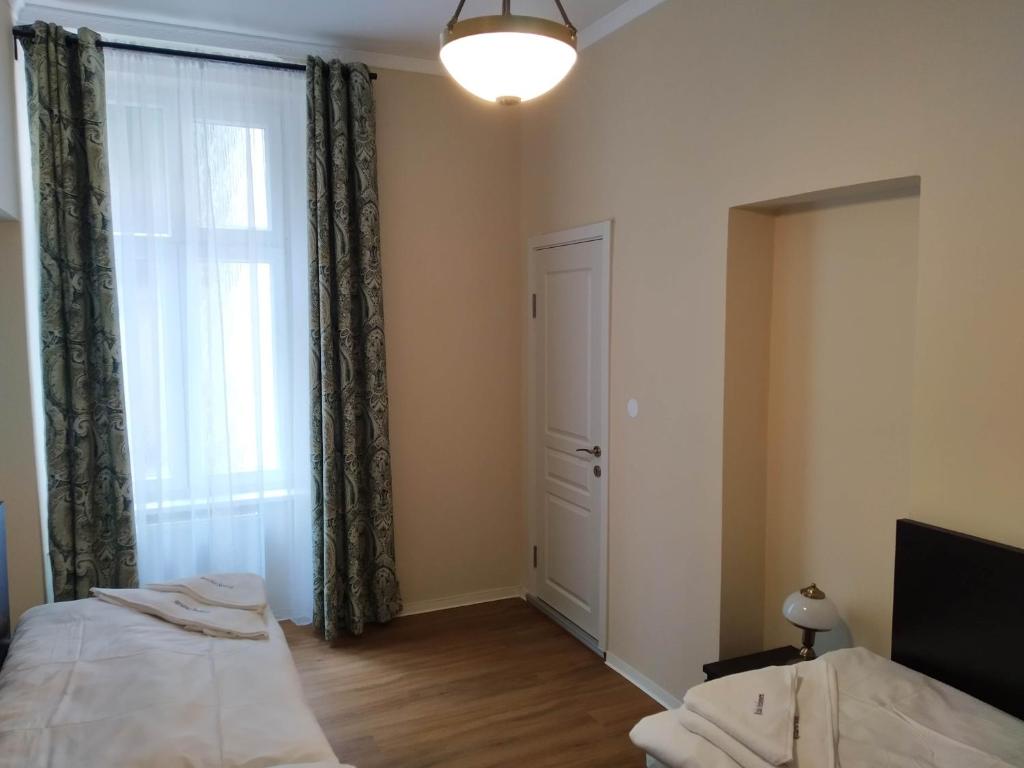Postel nebo postele na pokoji v ubytování Rezidence Beethoven