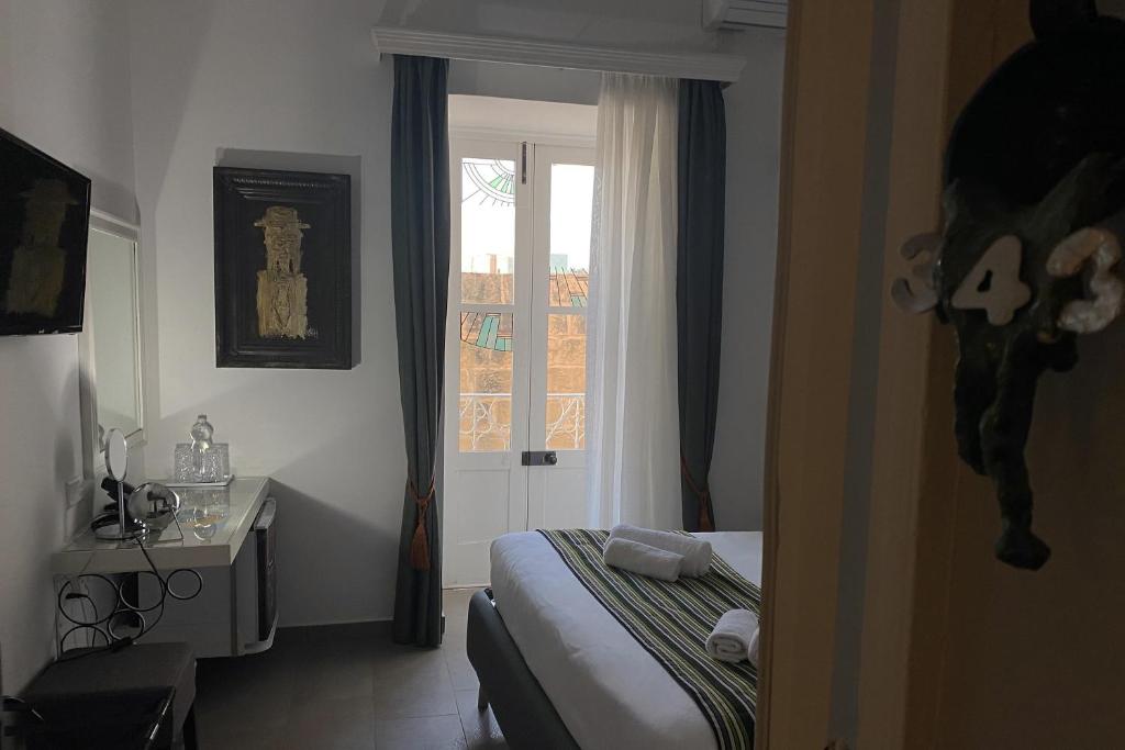 Postel nebo postele na pokoji v ubytování BOCO Boutique Hotel