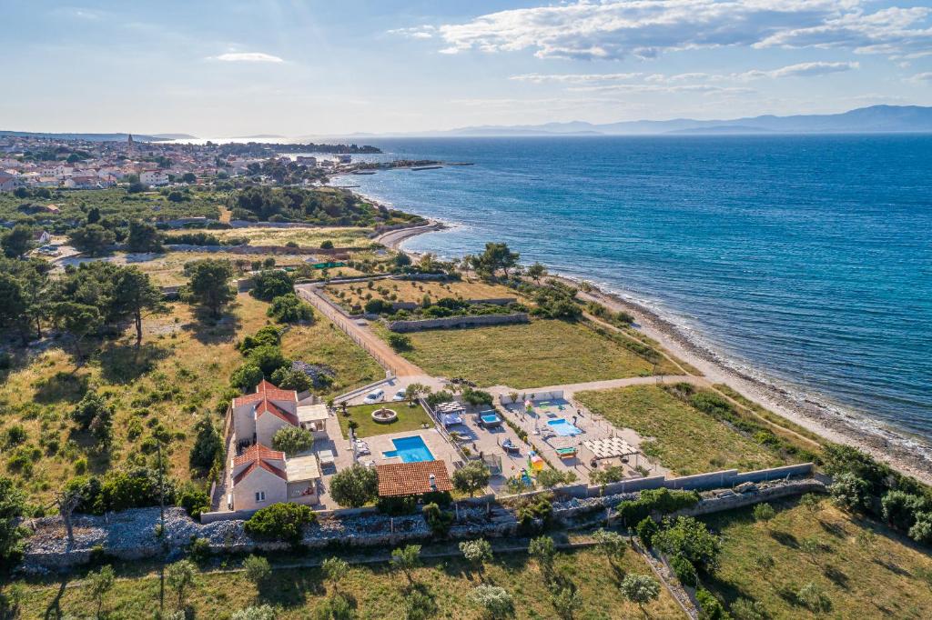 an aerial view of a house and the ocean at Villa Mis in Supetar