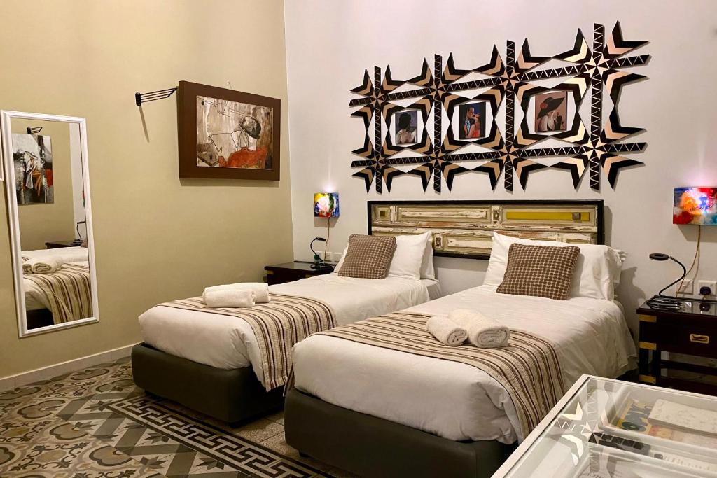 Postel nebo postele na pokoji v ubytování BOCO Boutique Hotel