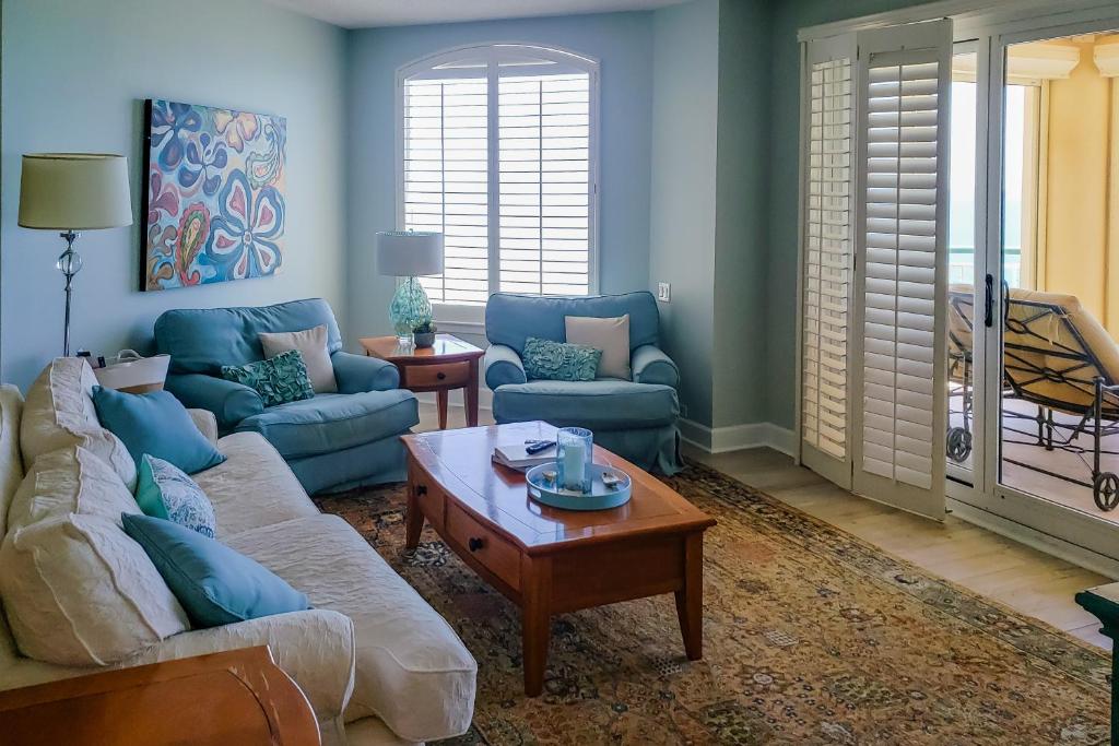 a living room with two couches and a coffee table at Beach Colony of Perdido West in Perdido Key