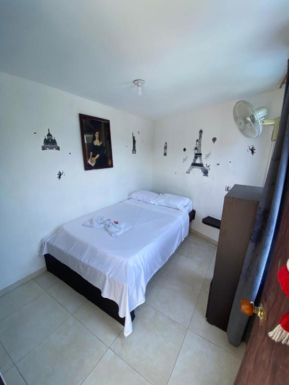Postel nebo postele na pokoji v ubytování Hotel Policarpa