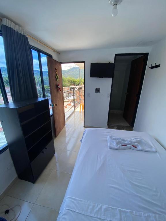 Postel nebo postele na pokoji v ubytování Hotel Policarpa