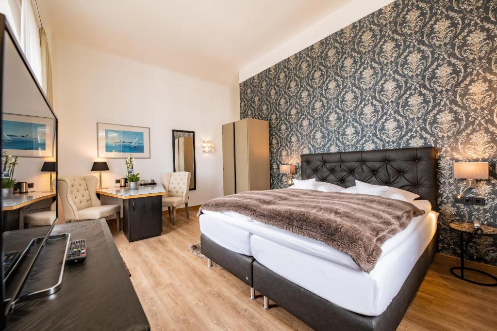 Postel nebo postele na pokoji v ubytování Boutique-Hotel Villa Anna