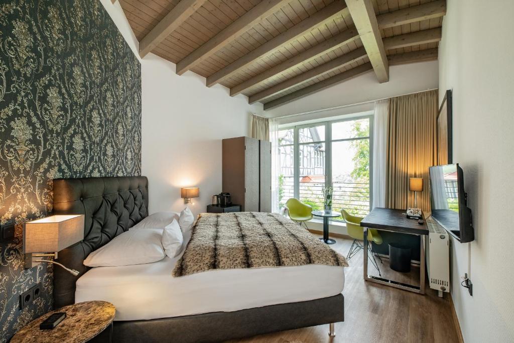 Postel nebo postele na pokoji v ubytování Boutique-Hotel Villa Anna