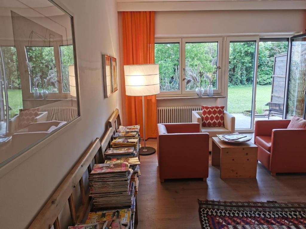 a living room with a couch and a mirror at Appartements Kortscherhof in Silandro