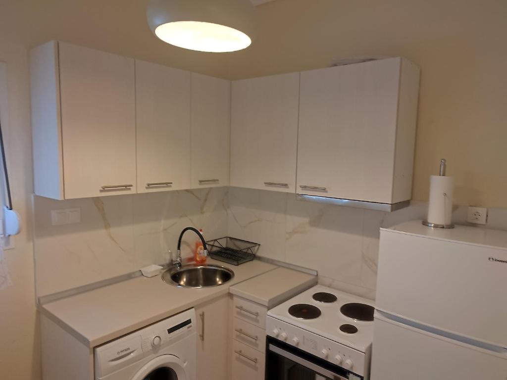 Kuchyň nebo kuchyňský kout v ubytování Estrella Rooms