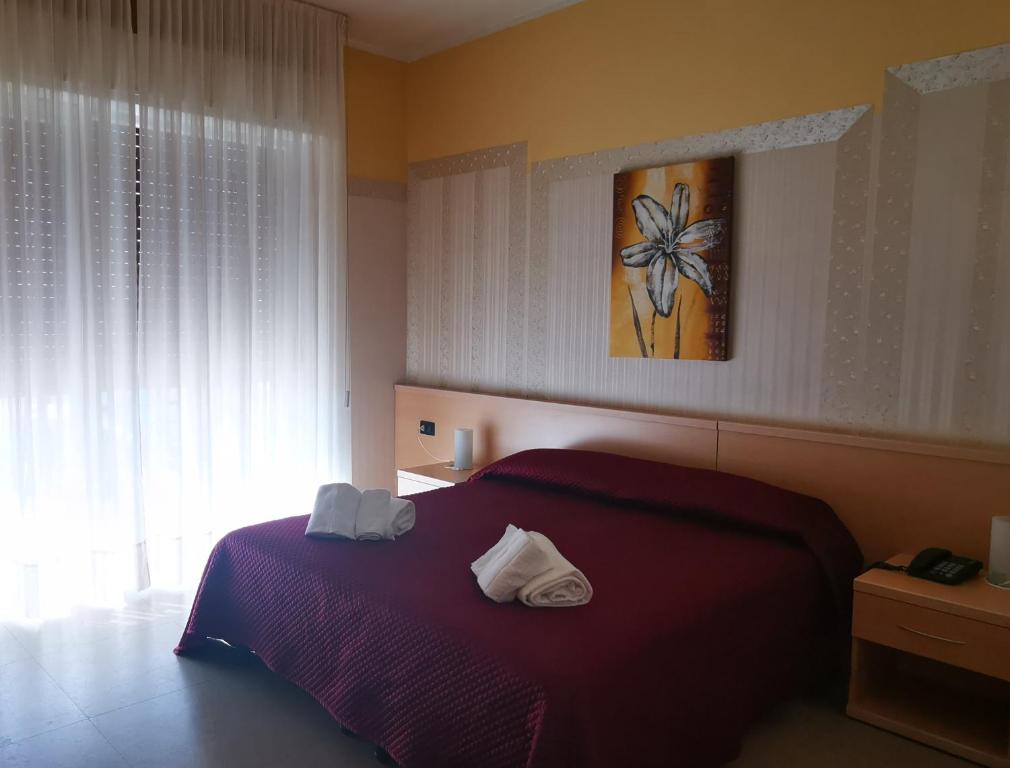 Postel nebo postele na pokoji v ubytování Hotel Aquavite