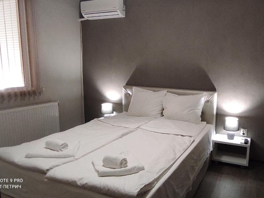 Postel nebo postele na pokoji v ubytování BeLApartment