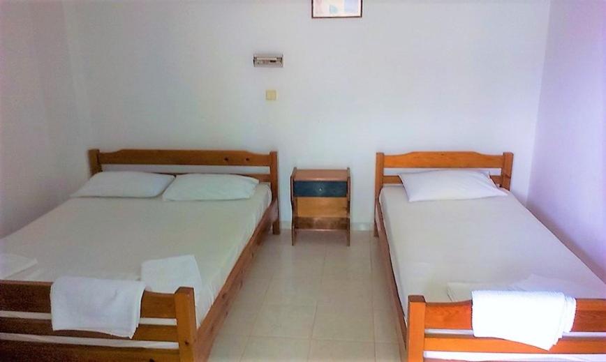 Postel nebo postele na pokoji v ubytování SIROS HOTEL