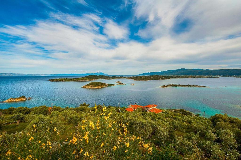 a view of a large body of water with islands at Thalassokipos in Vourvourou