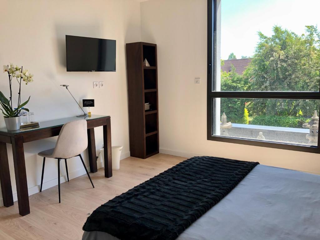 Postel nebo postele na pokoji v ubytování HÔTELYA - Lille Villeneuve d'Ascq