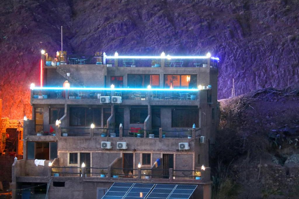 a building with blue lights on top of it at Toubkal Garden in Imlil