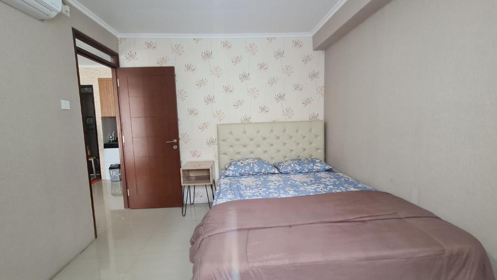 Gateway Pasteur 2BR tower depan Ruby 7 C客房内的一张或多张床位