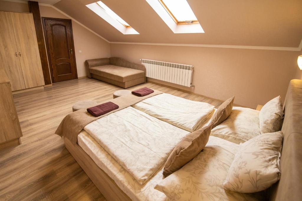 Postel nebo postele na pokoji v ubytování Praktik Hotel & Restaurant