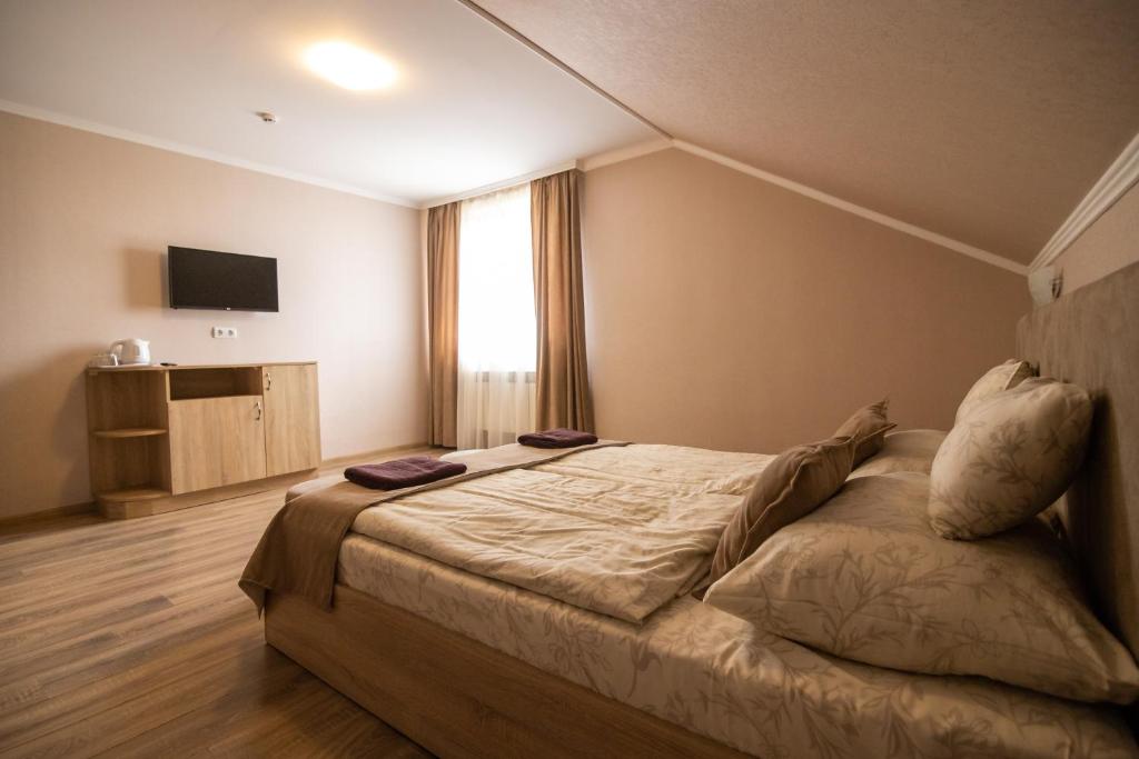 TV a/nebo společenská místnost v ubytování Praktik Hotel & Restaurant