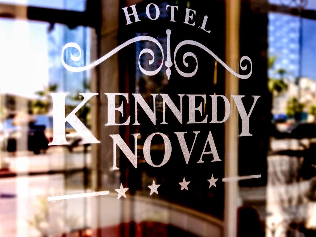 a sign in the window of a hotel kennedy nova at Hotel Kennedy Nova in Il-Gżira