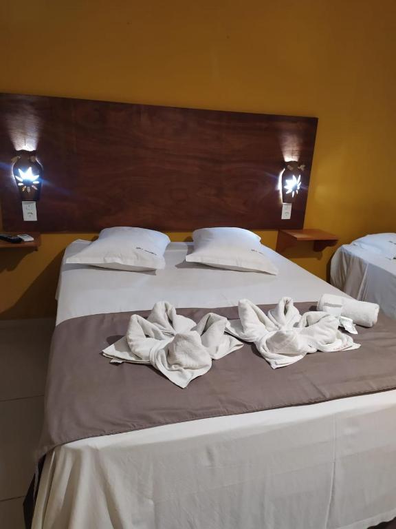 Postel nebo postele na pokoji v ubytování Maré Praia Hotel