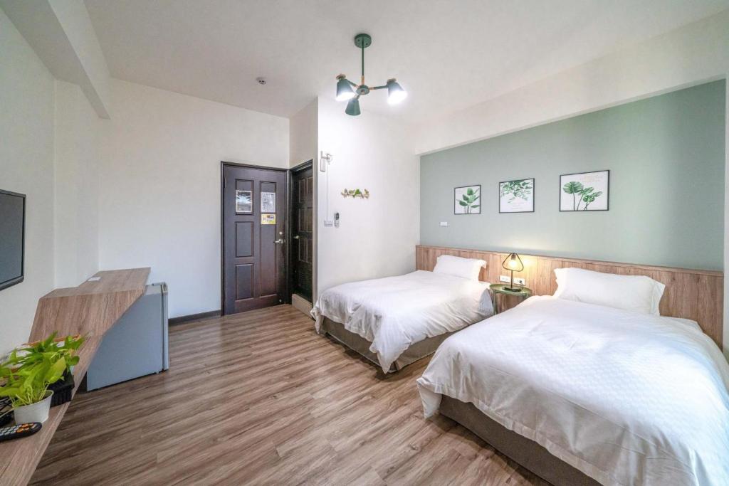 Park Oasis Tainan Villaにあるベッド