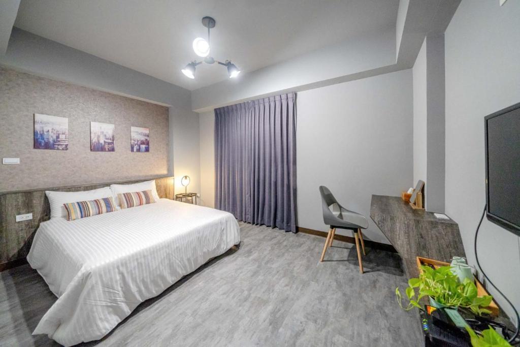Park Oasis Tainan Villaにあるベッド