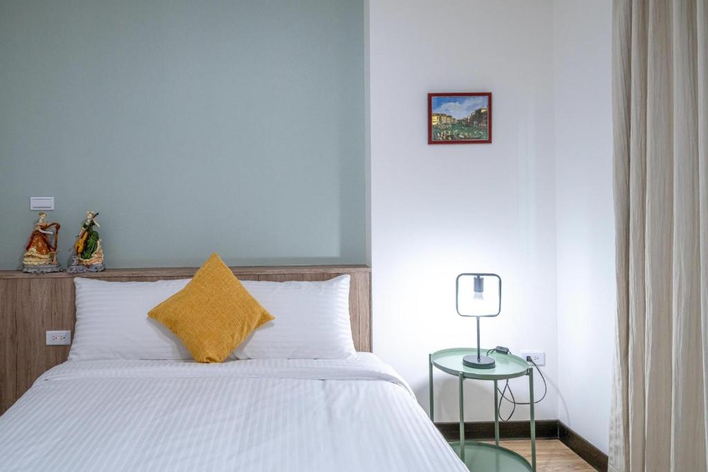 Park Oasis Tainan Villaにあるベッド