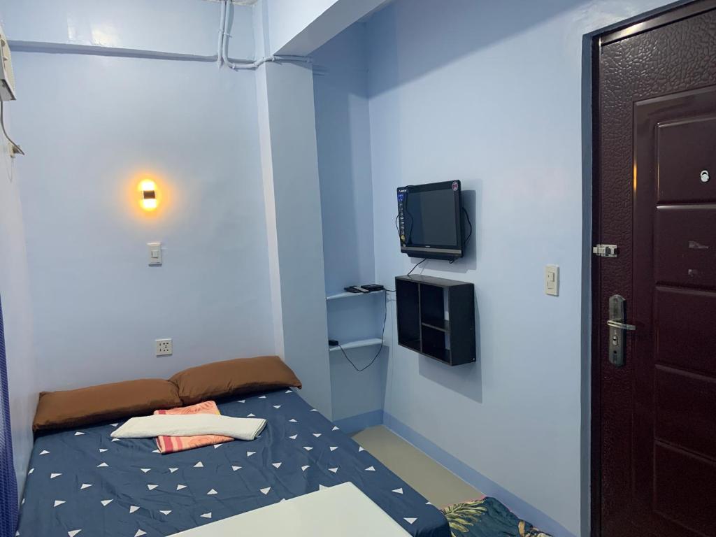 Postel nebo postele na pokoji v ubytování RGC Residences