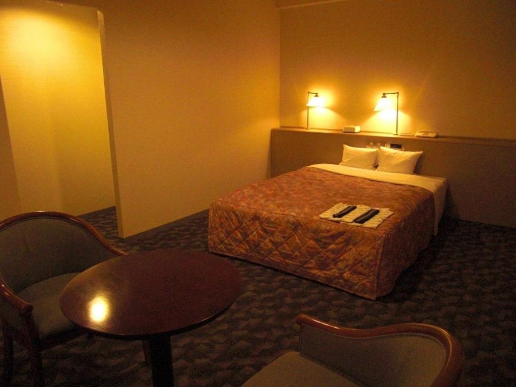 Кровать или кровати в номере Main Hotel - Vacation STAY 82551