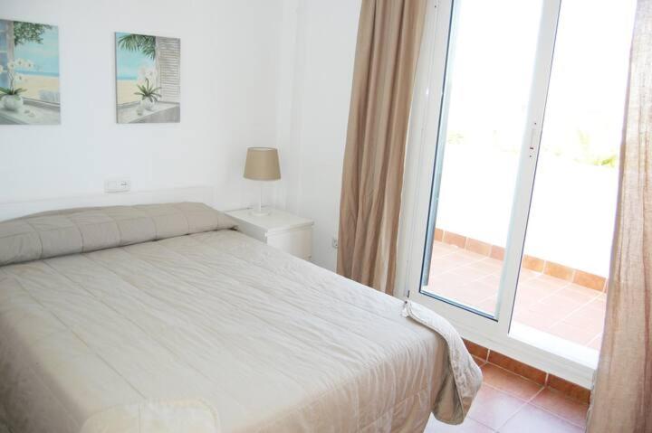 Łóżko lub łóżka w pokoju w obiekcie Chalet Paraíso Buganvillas