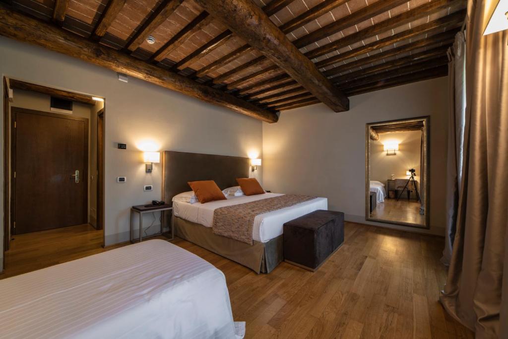 Postel nebo postele na pokoji v ubytování Relais Della Rovere