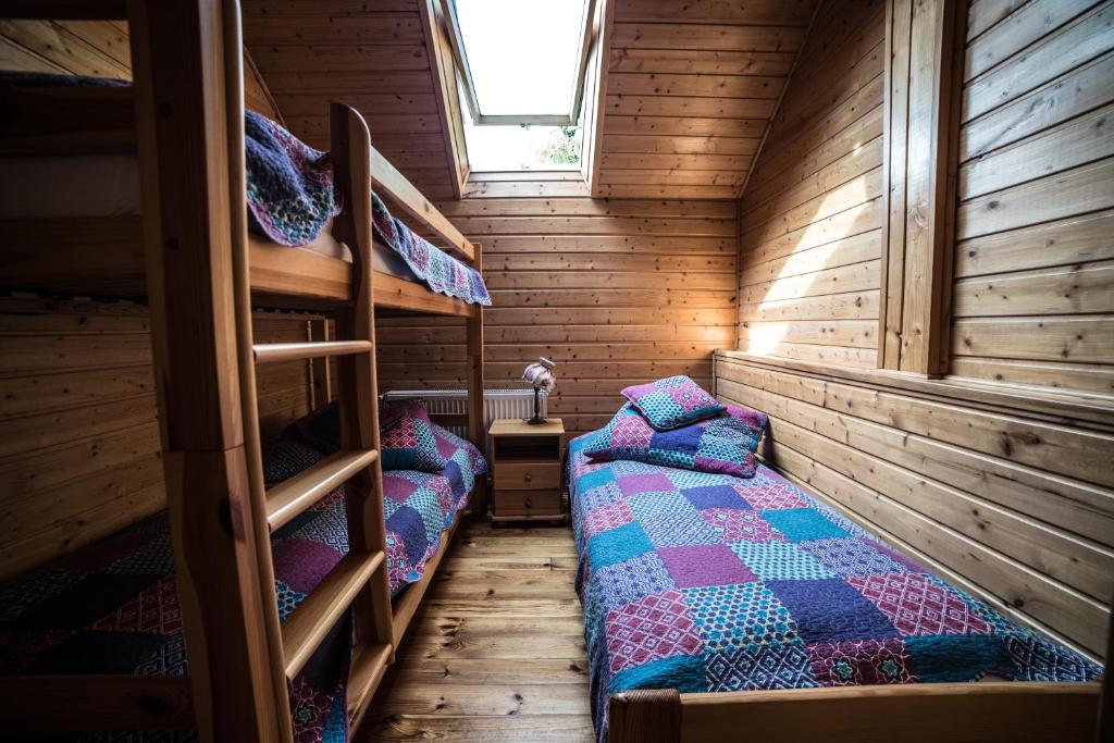Posteľ alebo postele v izbe v ubytovaní Apartamenty na Kasztelańskiej