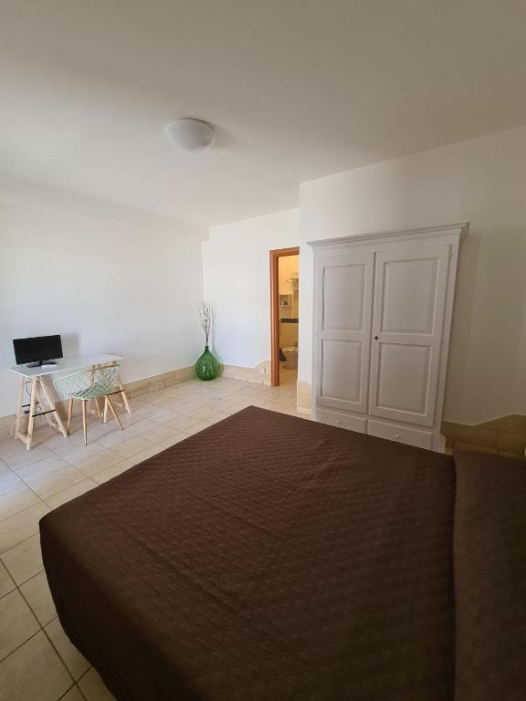 Postel nebo postele na pokoji v ubytování Donna Rosa B&B