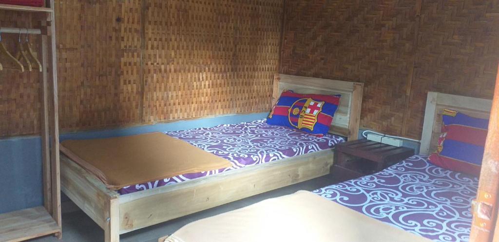 Postel nebo postele na pokoji v ubytování D'corner Homestay
