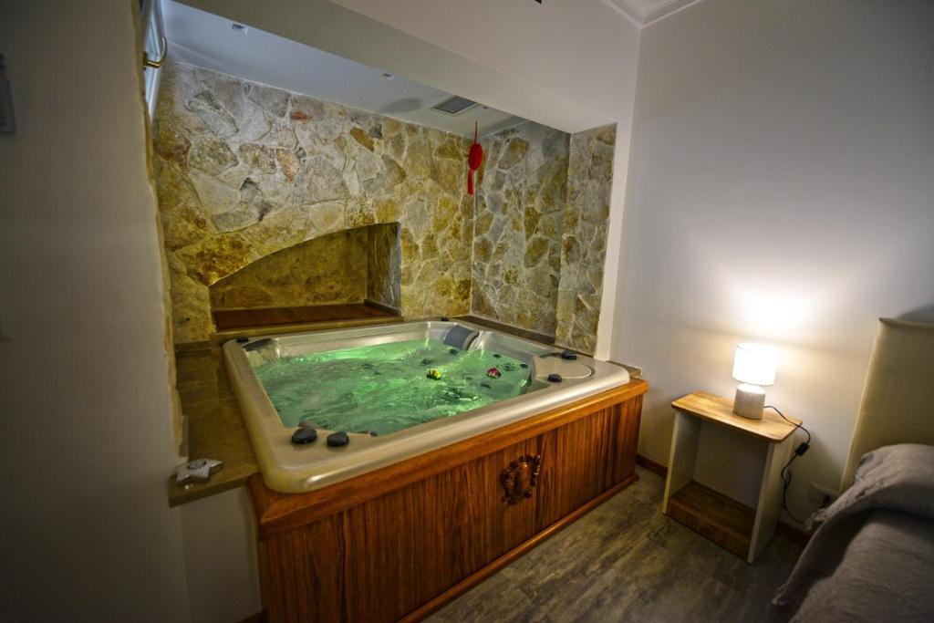 a bathroom with a jacuzzi tub in a room at “A Casa” luxury in Francavilla Fontana