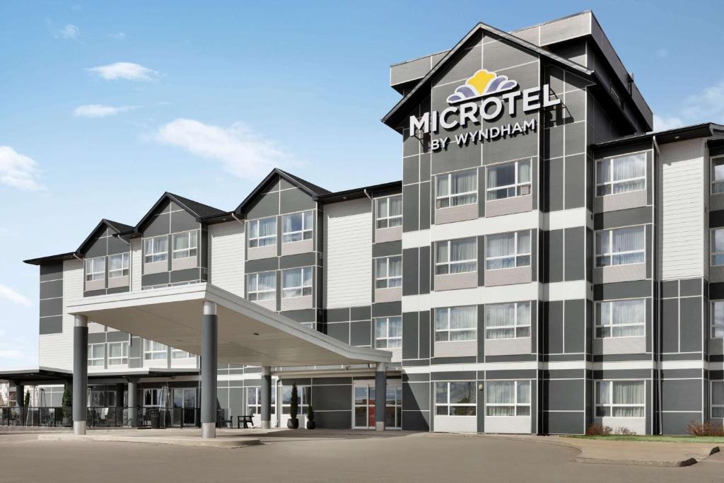 a rendering of the exterior of a hotel at Microtel Inn & Suites by Wyndham Estevan in Estevan