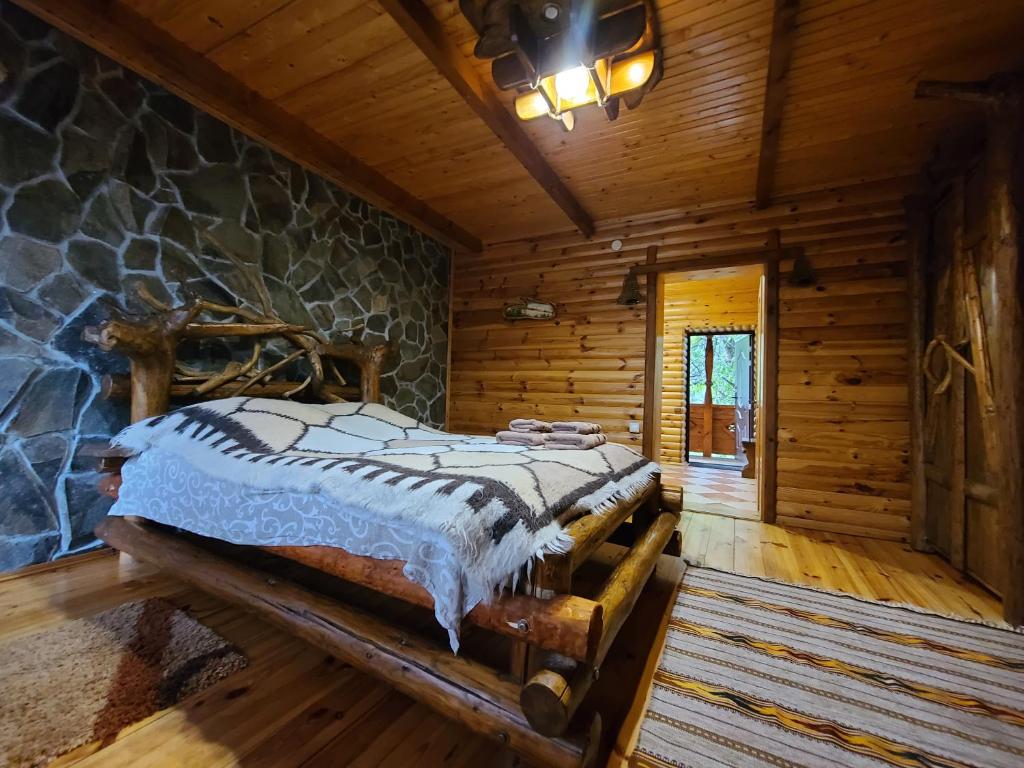 Postel nebo postele na pokoji v ubytování Гуцульська хата