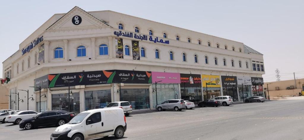 a white van parked in front of a building at سماية للأجنحة الفندقية in Riyadh