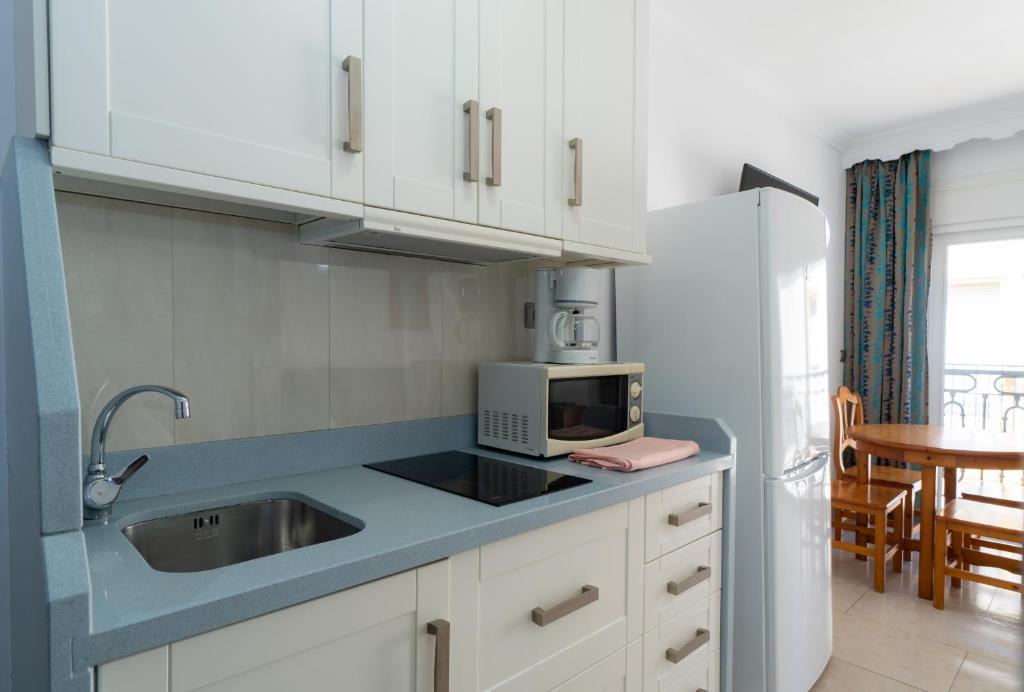 Kuchyňa alebo kuchynka v ubytovaní Apartamentos Caracas