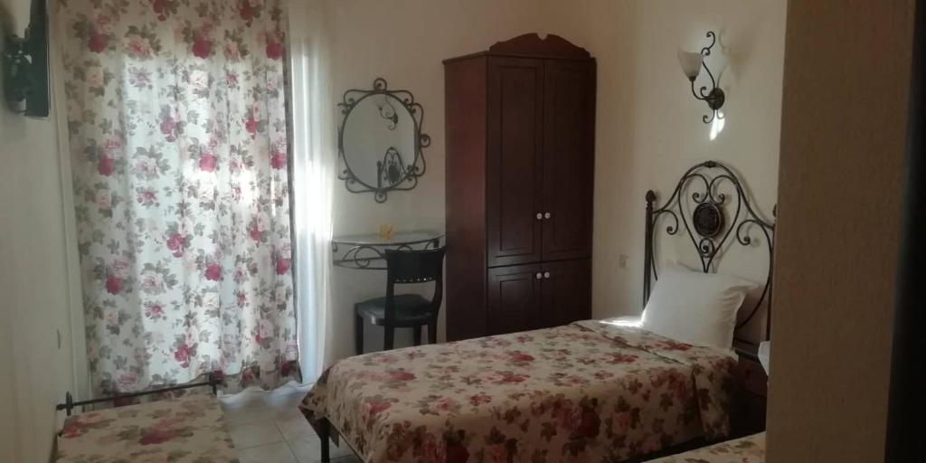 Postel nebo postele na pokoji v ubytování Xenios Zeus