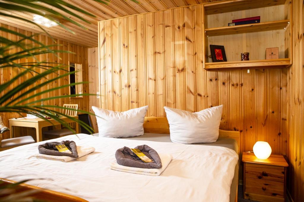 Postel nebo postele na pokoji v ubytování Pension Haus Fürstenberg